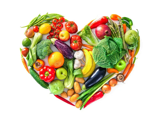 fruits and vegetables in the shape of a heart