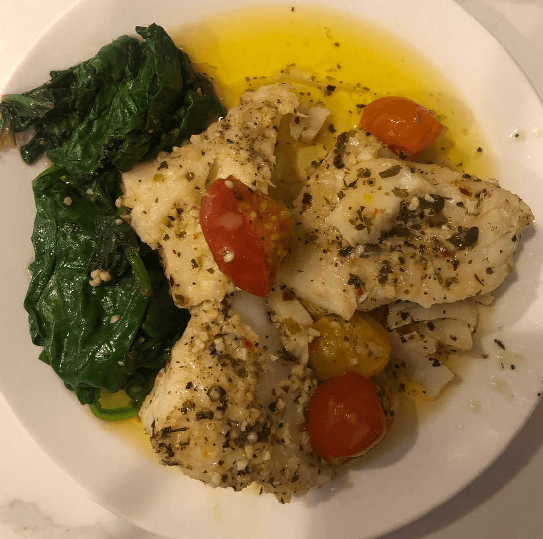 Baked Cod In A Garlic Butter Sauce With Spinach
